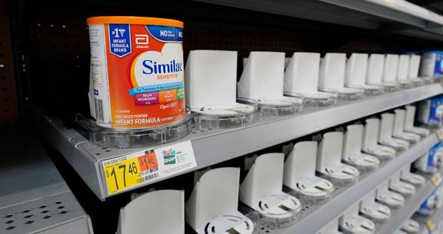 Empty shelf with a single can of baby formula