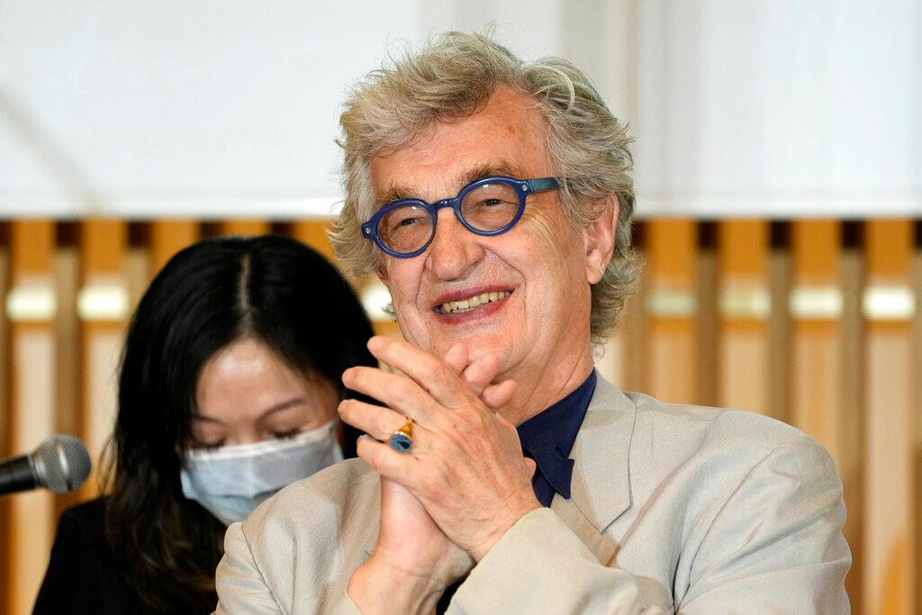 Filmmaker Wim Wenders smiles during a press gathering