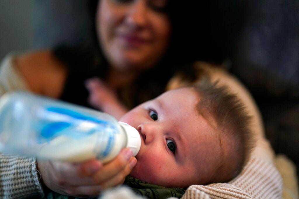 Ashley Maddox feeds her 5-month-old son, Cole, with formula she bought through a Facebook group of mothers in need