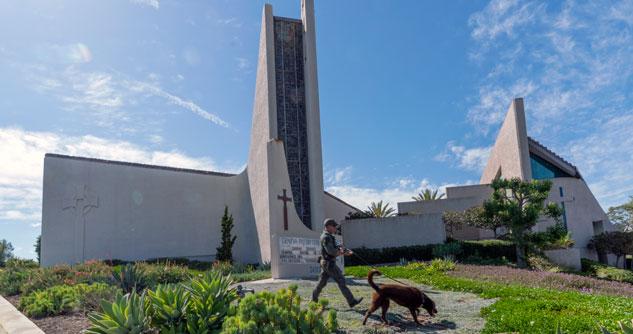 Church with an officer walking a K-9 unit 