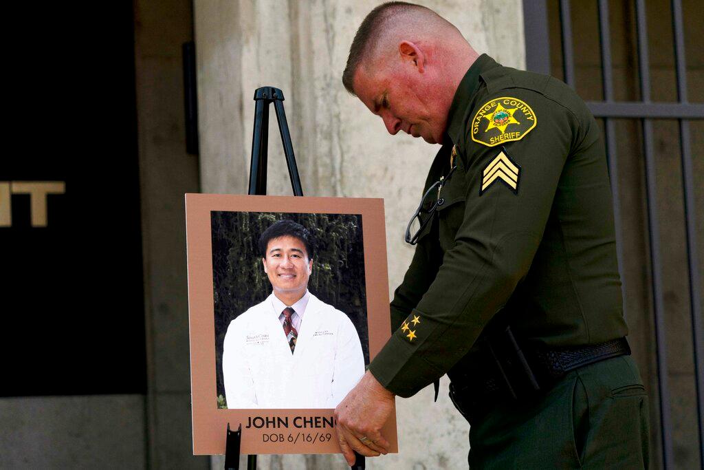 Orange County Sheriff's Sgt. Scott Steinle displays a photo of Dr. John Cheng