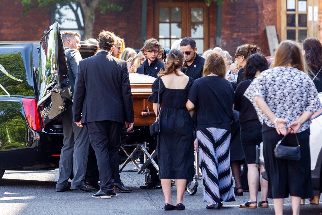 The casket of Roberta Drury is brought into her funeral service, Saturday, May 21, 2022, in Syracuse, N.Y. Drury was one of 10 killed during a mass shooting at a supermarket last week in Buffalo.