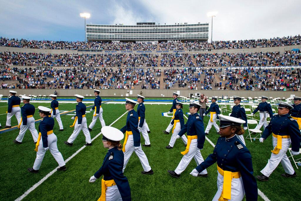 Air Force Academy cadets make their way to their seats during the United States Air Force Academy's Class of 2021 graduation ceremony
