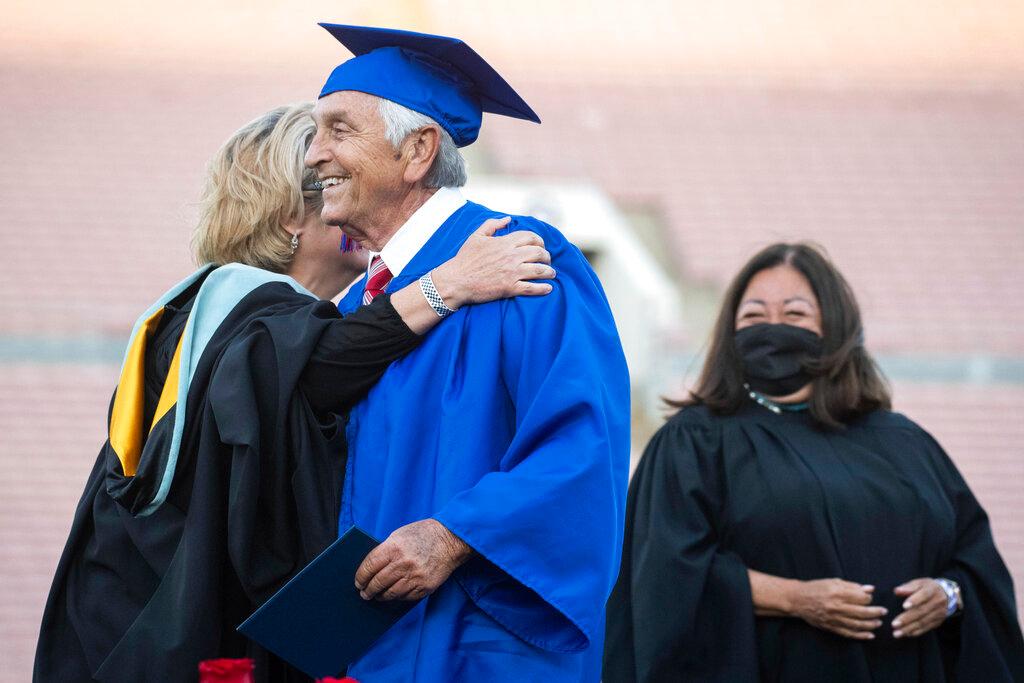 Ted Sams, 78, receives his original high school diploma during San Gabriel High School's graduation at the Rose Bowl