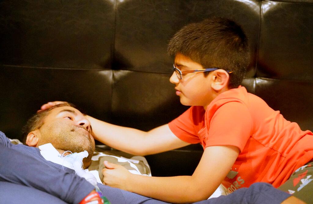 boy helping father