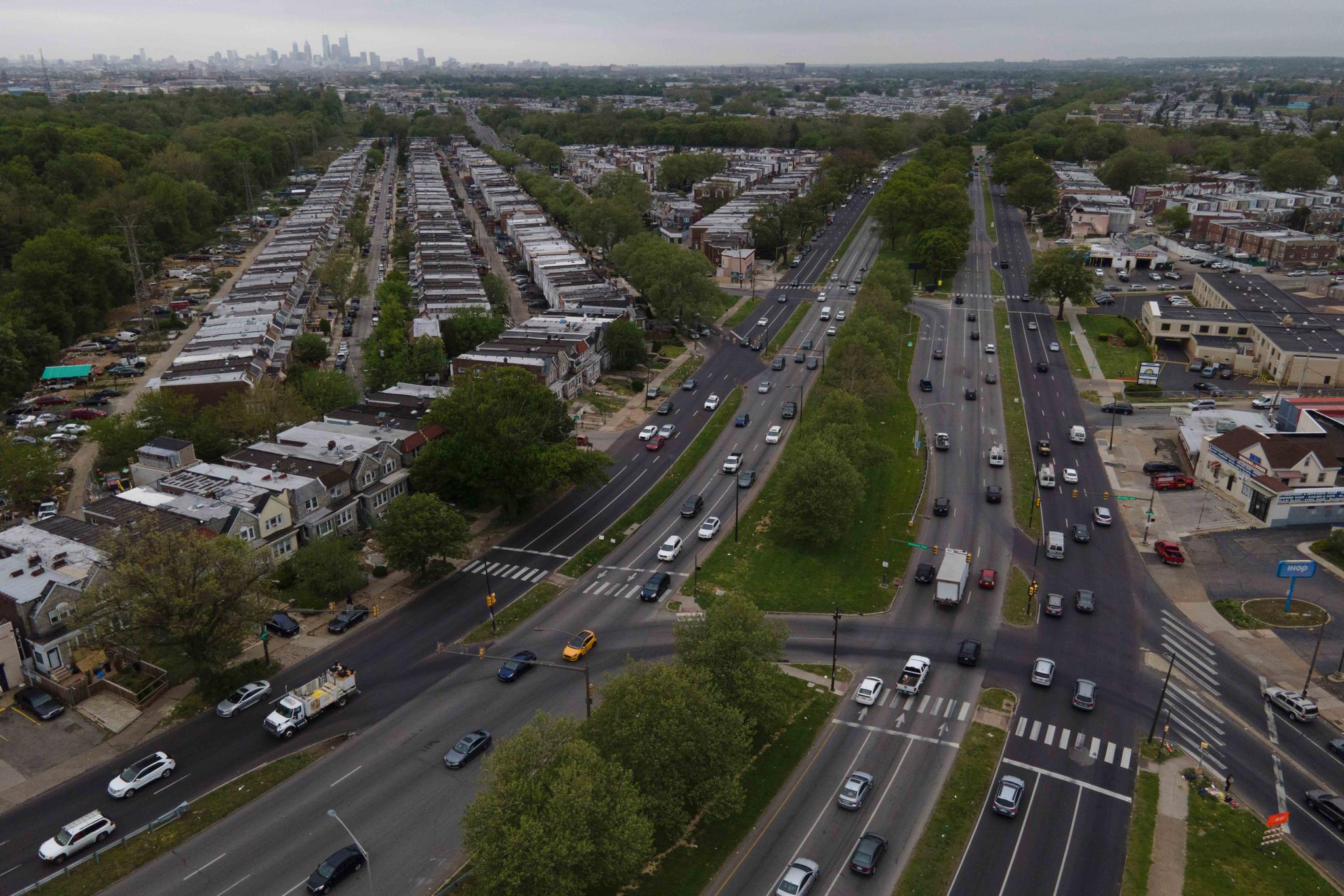 The Philadelphia skyline, top, is seen at a distance as vehicular traffic flows along Roosevelt Boulevard at the intersection with Whitaker Avenue, Thursday, May 12, 2022, in Philadelphia.