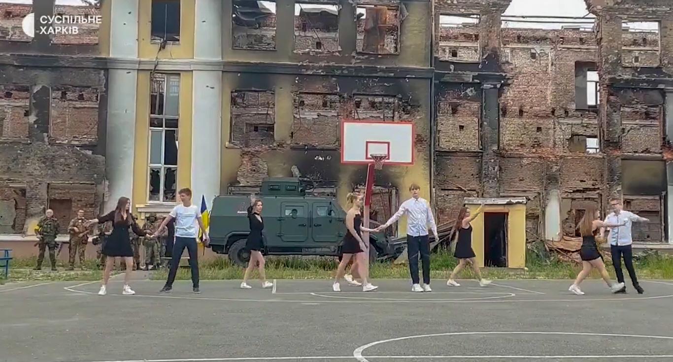 Students of School #134, Kharkiv, danced their prom waltz against the backdrop of the ruins of their Alma mater
