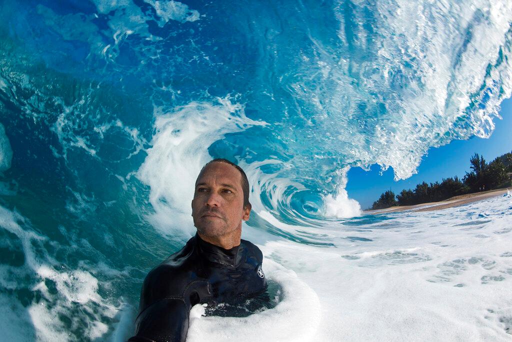 Clark Little takes a selfie as he photographs waves on the North Shore of Oahu near Haleiwa, Hawaii.