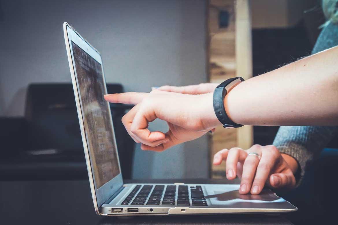 Two people working at computer