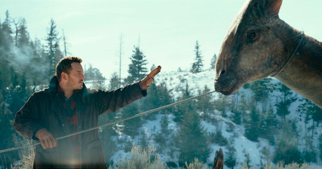 his image released by Universal Pictures shows Chris Pratt in a scene from "Jurassic World Dominion."