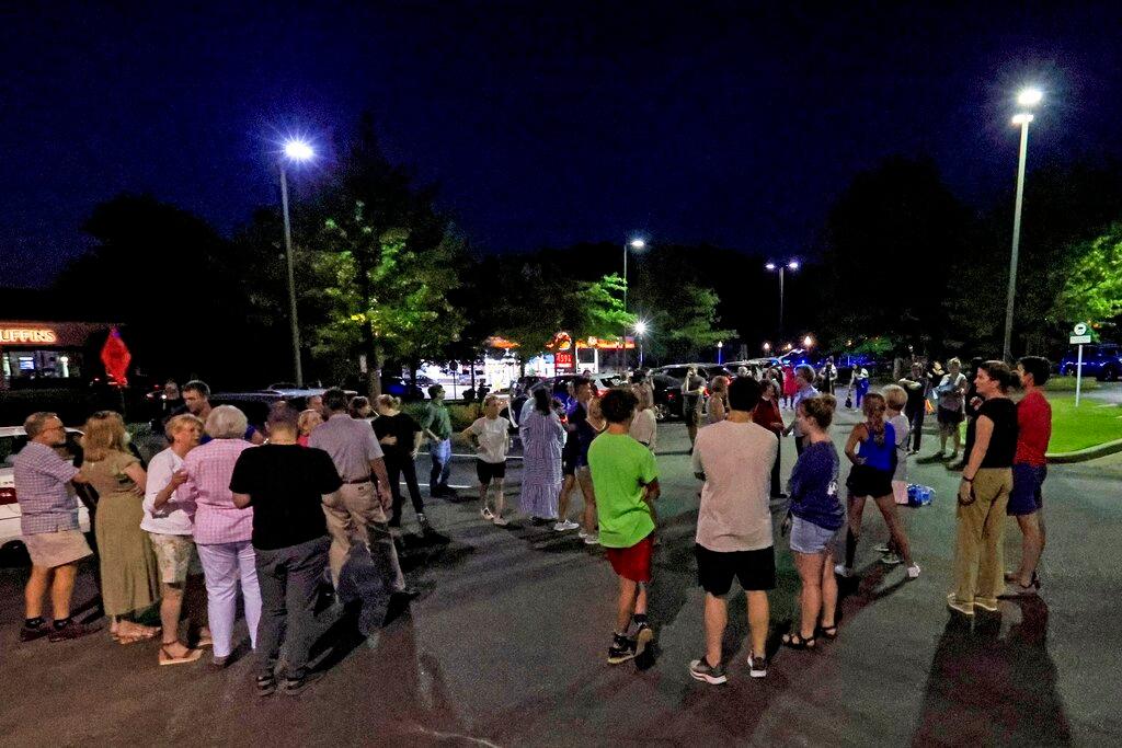 Church members gather for a prayer circle after a shooting at the Saint Stevens Episcopal Church 