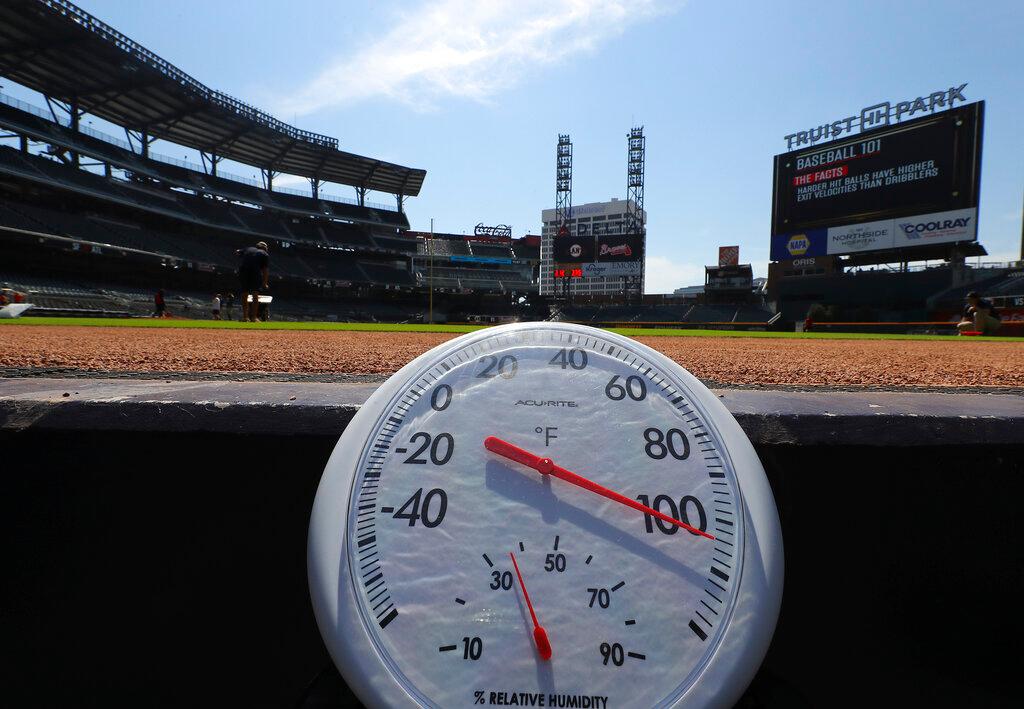 Temperature shows over 100 degrees before a baseball game between the Atlanta Braves and San Francisco Giants at Truist Park in Atlanta