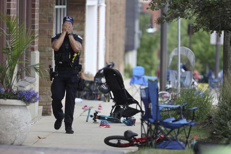 police officer walking down sidewalk