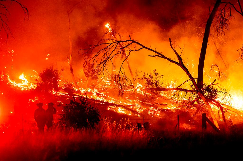 Firefighters battle the Electra Fire in the Rich Gulch community of Calaveras County, Calif.