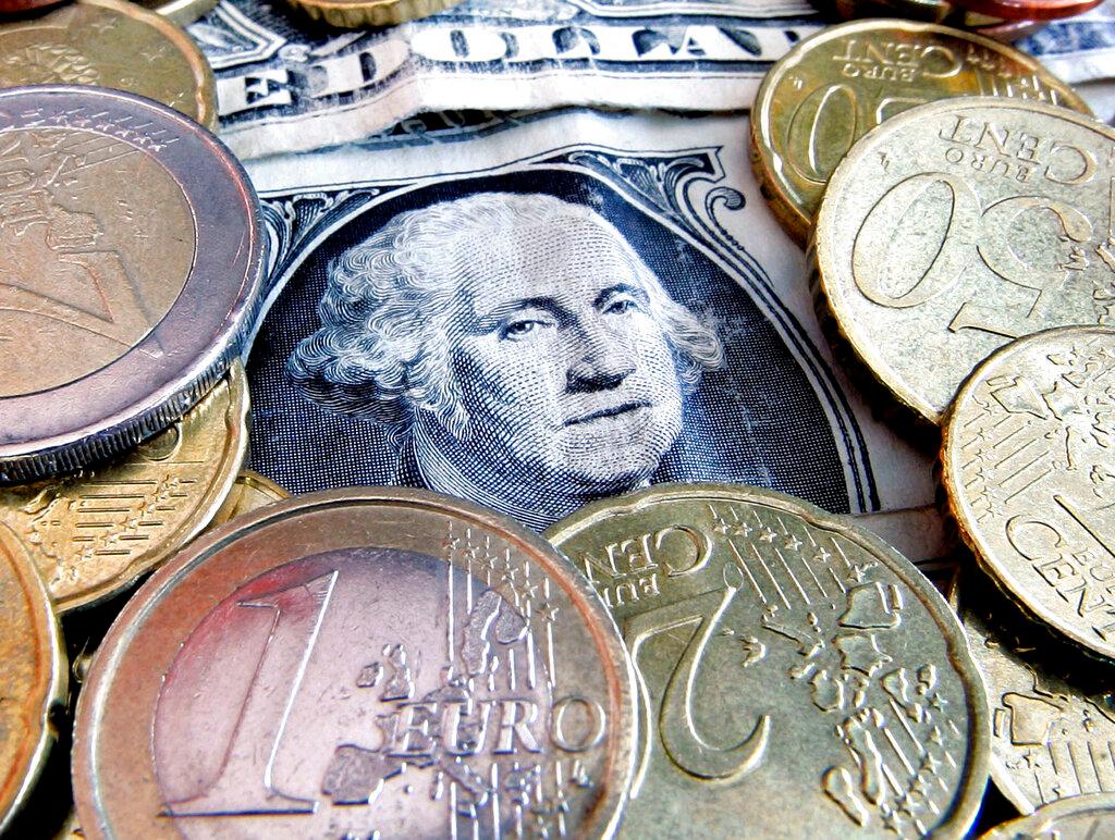 Euro coins and dollar bills