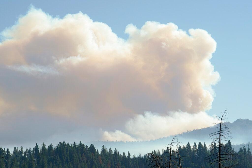 Smoke rises from the Washburn Fire burning in Yosemite National Park, Calif.