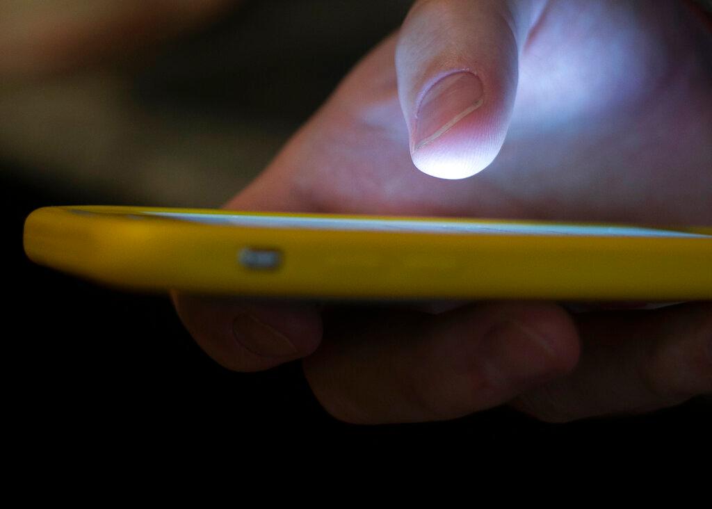 man uses a cell phone 