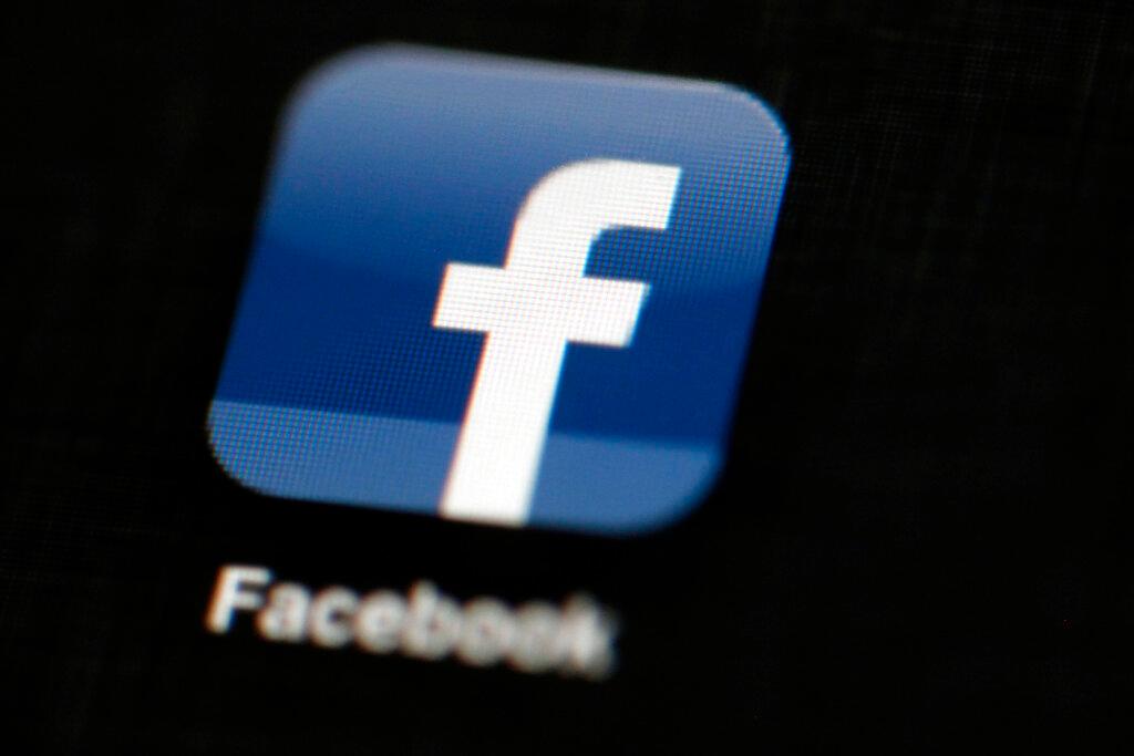 Facebook logo is displayed on an iPad
