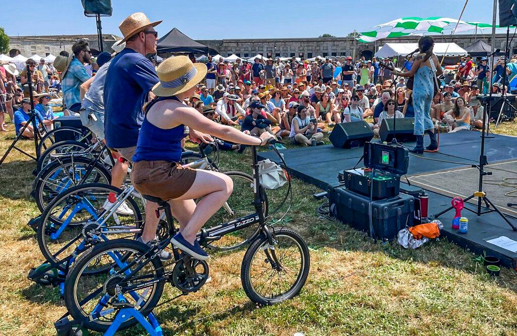 concert goers on bikes