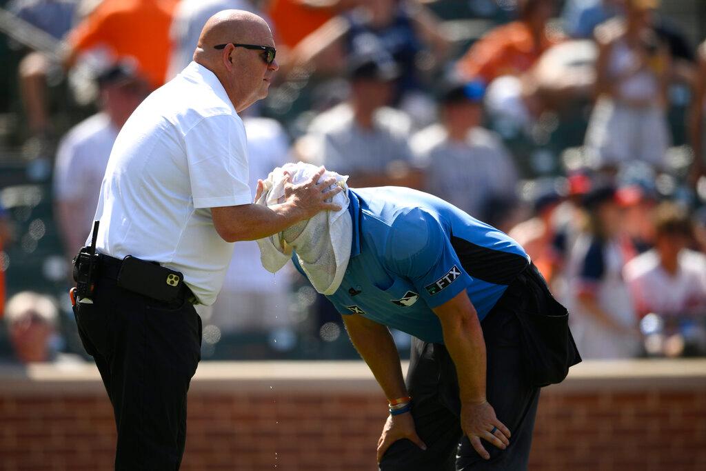 Two guys on hot day at the ballpark 