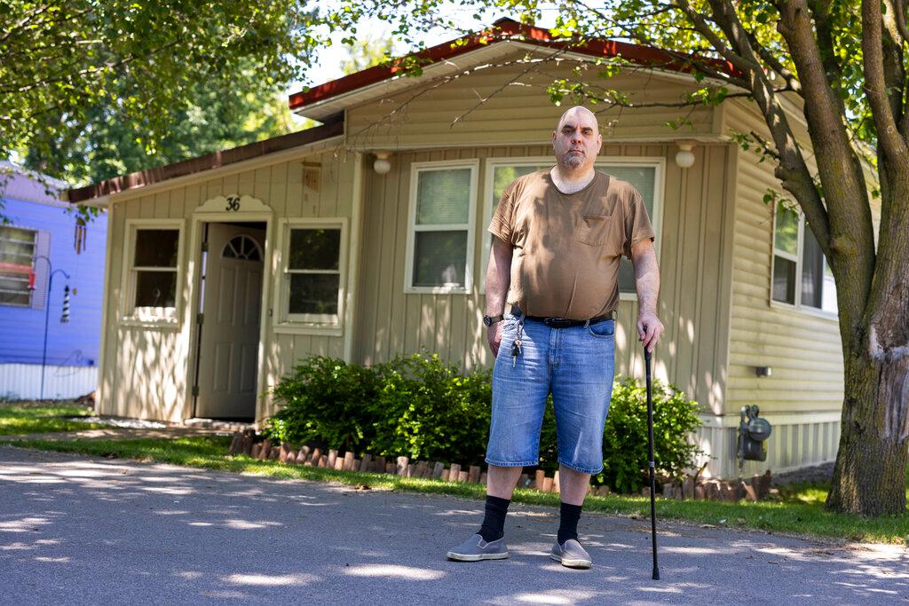 Jeremy Ward in front of his home in the Ridgeview Homes mobile home community in Lockport, N.Y.