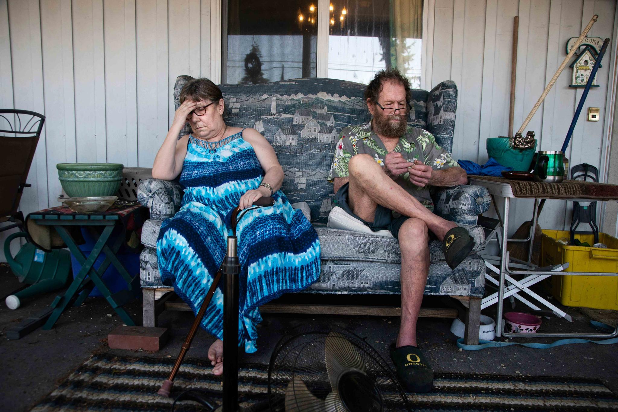 Judy, left, and Merlyn Webber sit out in front of their home at Mobile Estates on Southeast Division Street in Portland, Ore., Tuesday, July 26, 2022.