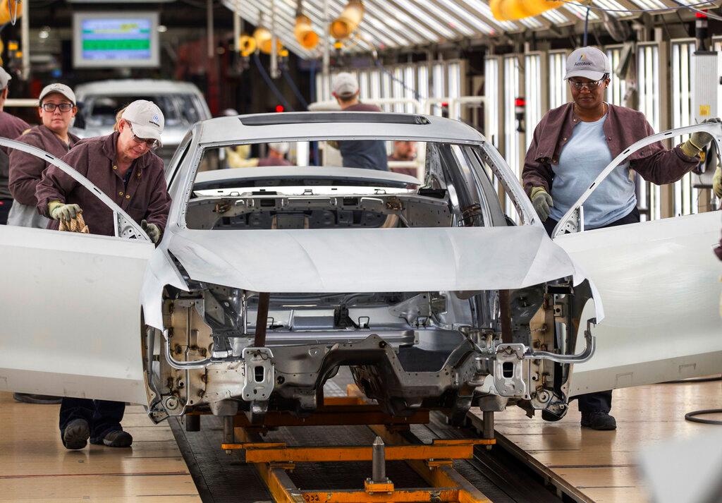 Workers produce vehicles at Volkswagen's U.S. plant in Chattanooga, Tenn.