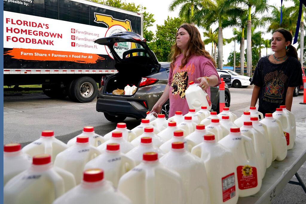 people picking up milk