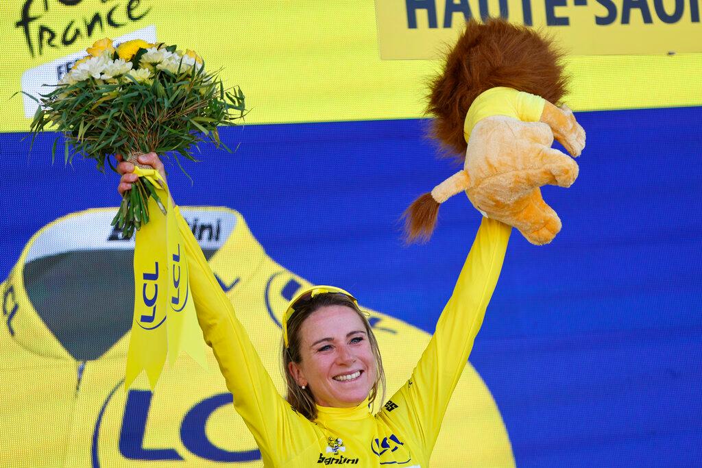 Woman raising arms in celebration after finishing 1st