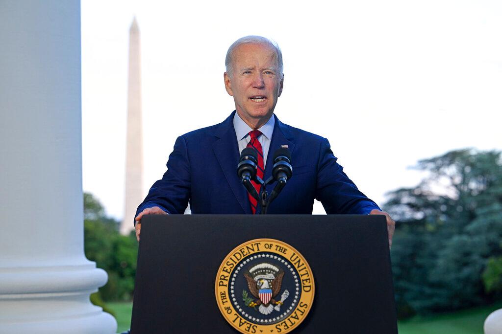 President Joe Biden speaks from the Blue Room Balcony of the White House