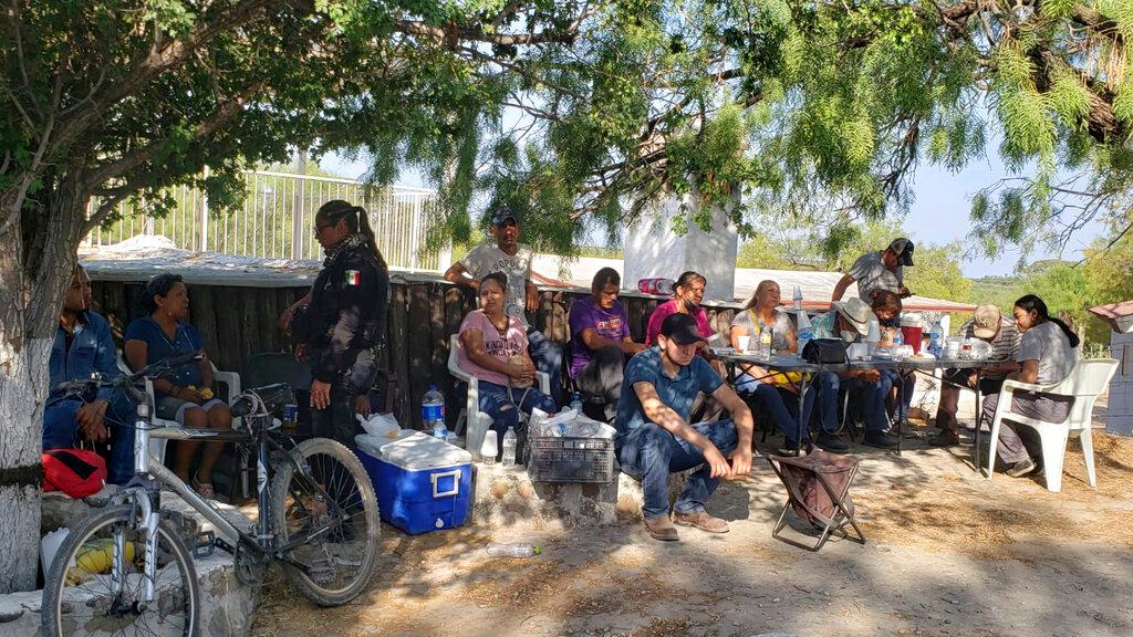 Relatives of miners who are trapped in a collapsed and flooded coal mine wait for information outside the mine in Sabinas in Mexico's Coahuila state