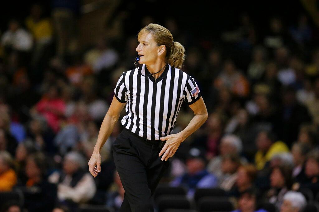 Female referee working a game