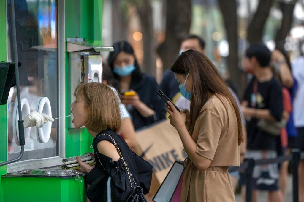 A crowd of people waiting to be tested