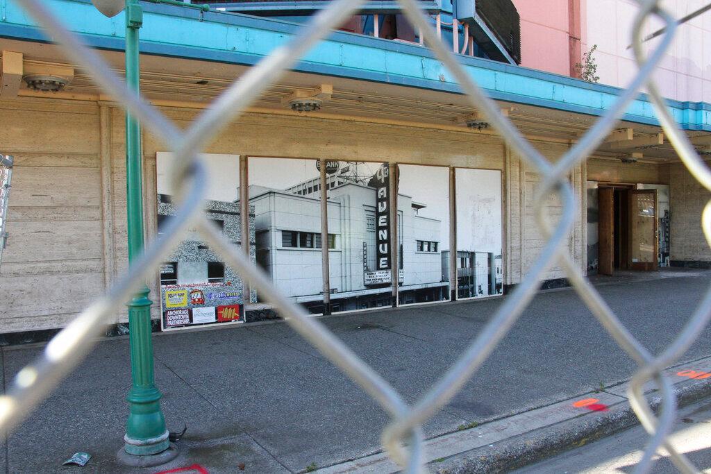 old building surround by link fence