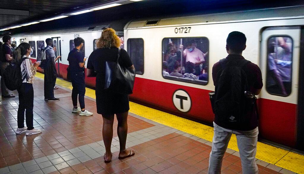 passengers waiting to embark on train