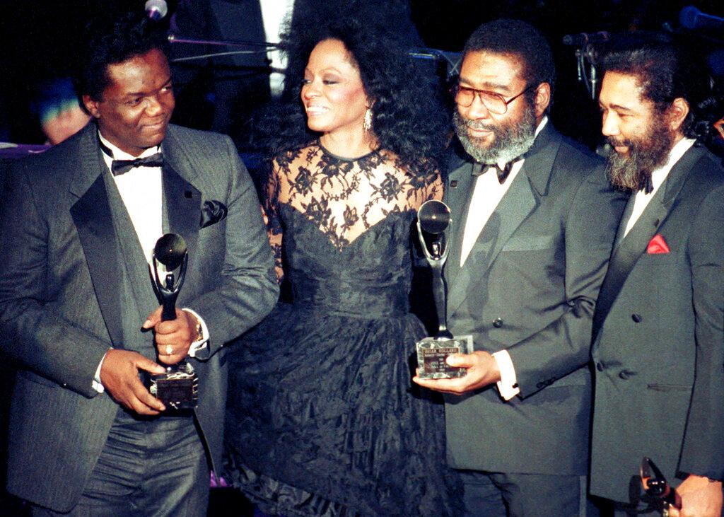 Singer Diana Ross, center, joins songwriters, from left, Lamont Dozier, Brian Holland and Eddie Holland  in New York, 1990