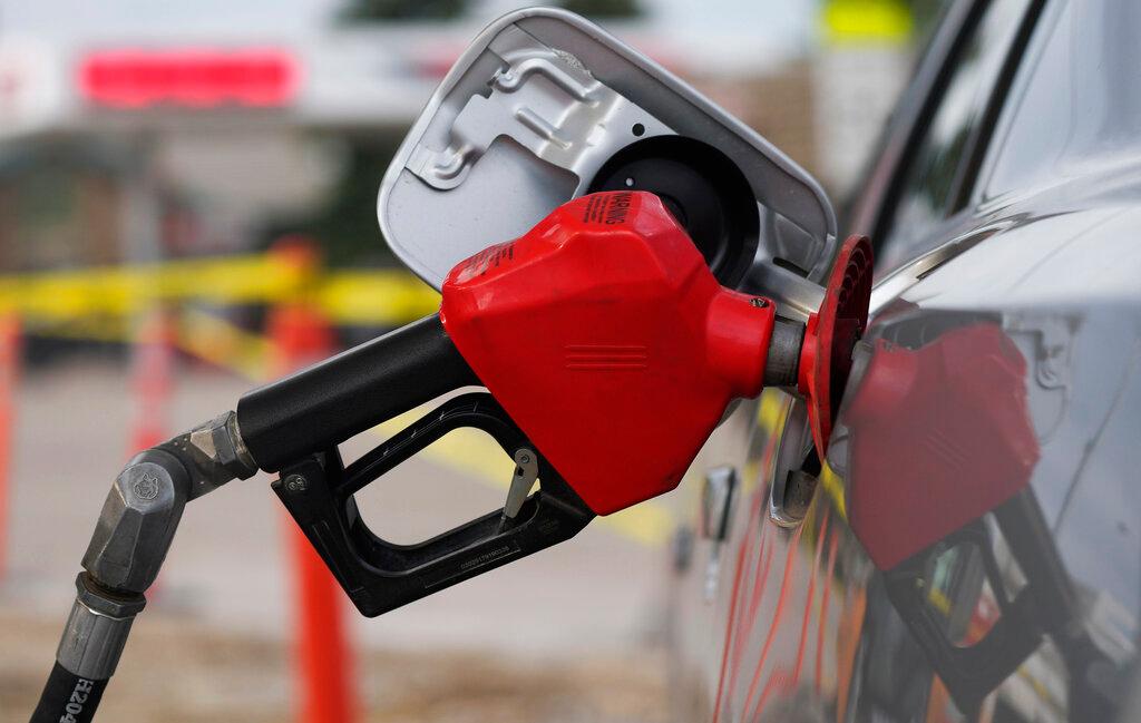 gas pump nozzle in car gas tank
