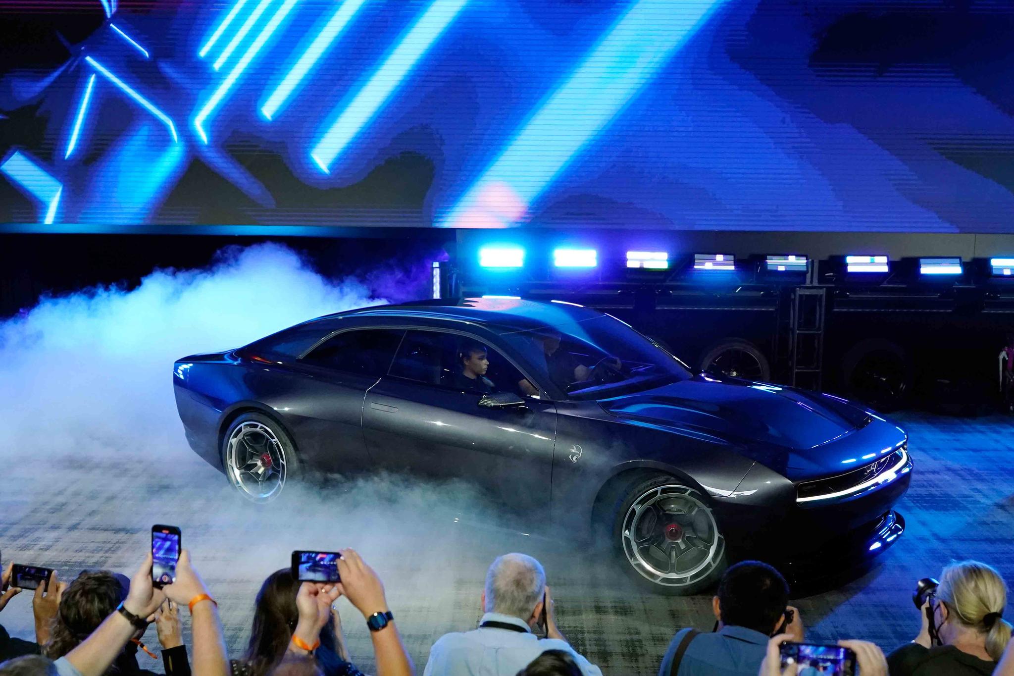The Dodge Charger Daytona SRT concept is unveiled, Wednesday, Aug. 17, 2022, in Pontiac, Mich. Thundering gas-powered muscle cars will be closing in on their final Saturday night cruises in the coming years as automakers begin replacing them with super-fast cars that run on batteries.