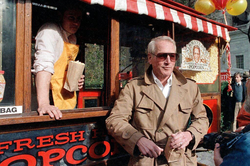 Paul Newman donates a popcorn stand to the City of New York, Nov. 15, 1984, for his "Newman's Own Popcorn," with profits donated to charity. 