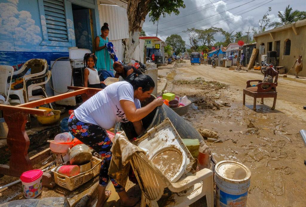 Residents work to recover belongings from flooding caused by Hurricane Fiona 