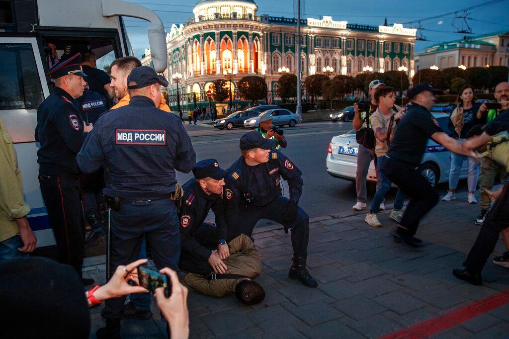 Police detain demonstrators during a protest against mobilization in Yekaterinburg, Russia