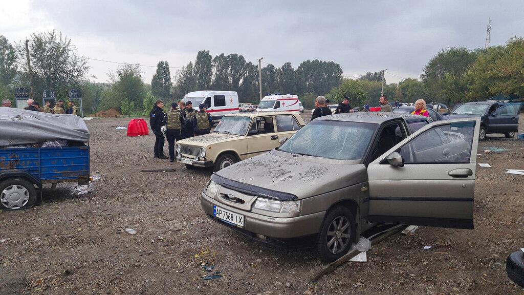 Image shows vehicles and police at the location after bombing.