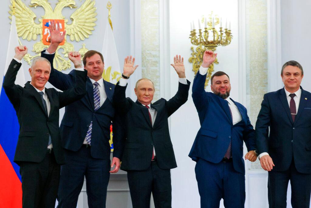 Moscow-appointed head of Kherson Region Vladimir Saldo, Moscow-appointed head of Zaporizhzhia region Yevgeny Balitsky, Russian President Vladimir Putin, center, Denis Pushilin, the leader of the Donetsk People's Republic and Leonid Pasechnik, leader of self-proclaimed Luhansk People's Republic 