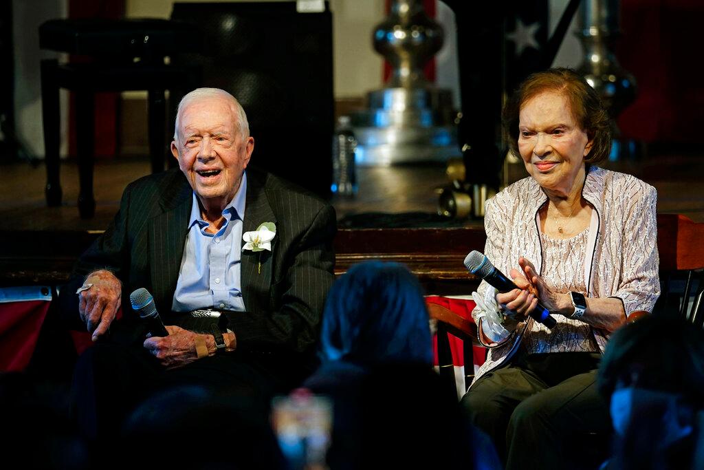 Former President Jimmy Carter and his wife former first lady Rosalynn Carter sit together during a reception to celebrate their 75th wedding anniversary Saturday, July 10, 2021