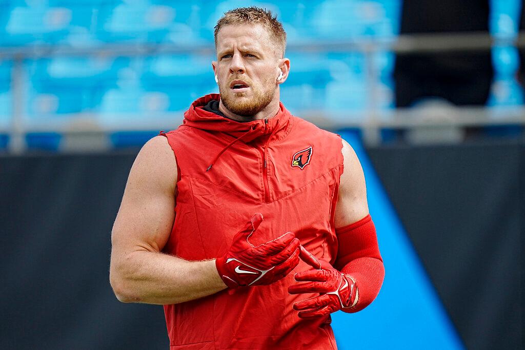 Arizona Cardinals defensive end J.J. Watt warms up before an NFL football game against the Carolina Panthers