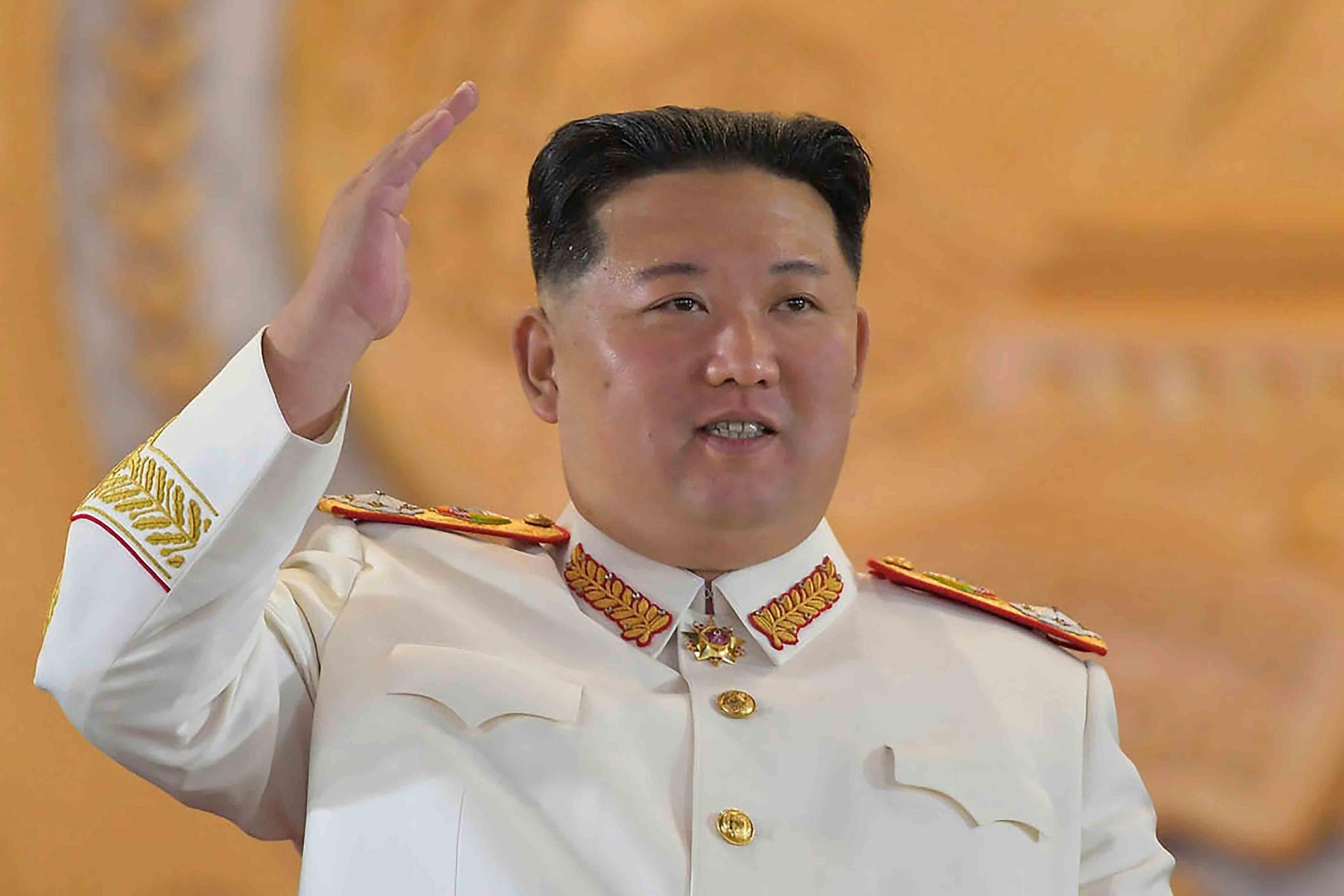 In this photo provided by the North Korean government, North Korean leader Kim Jong Un watches a military parade to mark the 90th anniversary of North Korea's army at the Kim Il Sung Square in Pyongyang, North Korea, on April 25, 2022. 