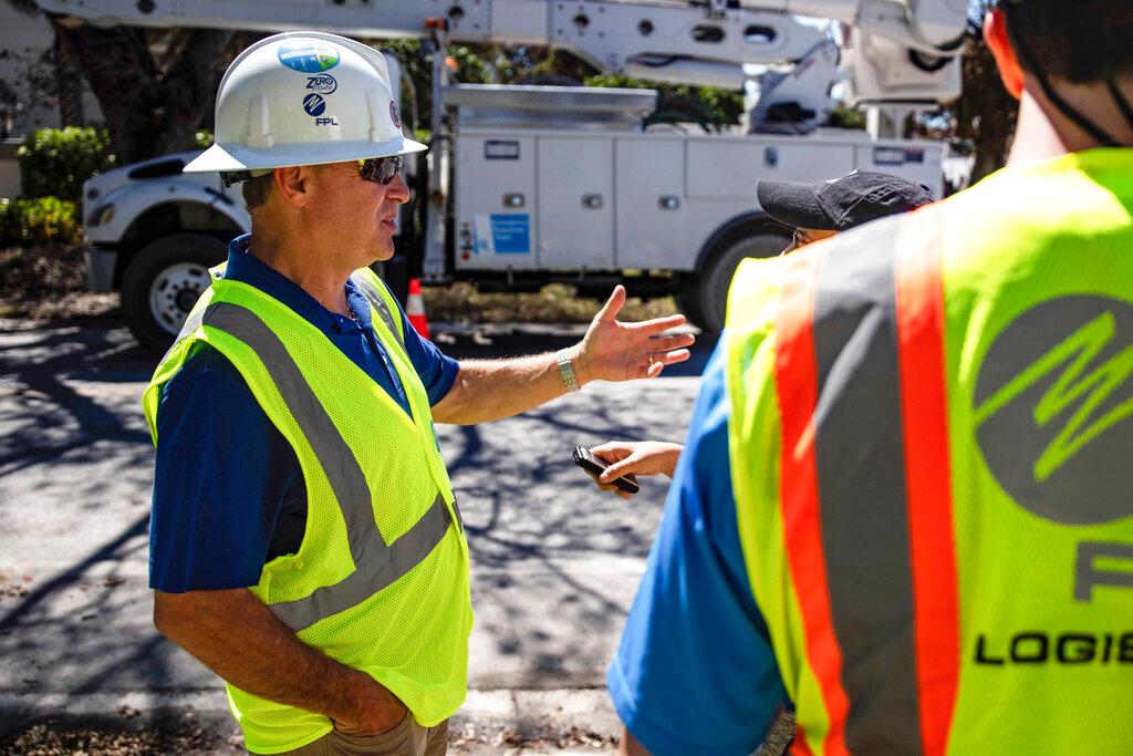 Florida Power and Light CEO Eric Silagy visits workers restoring power in Naples, Fla