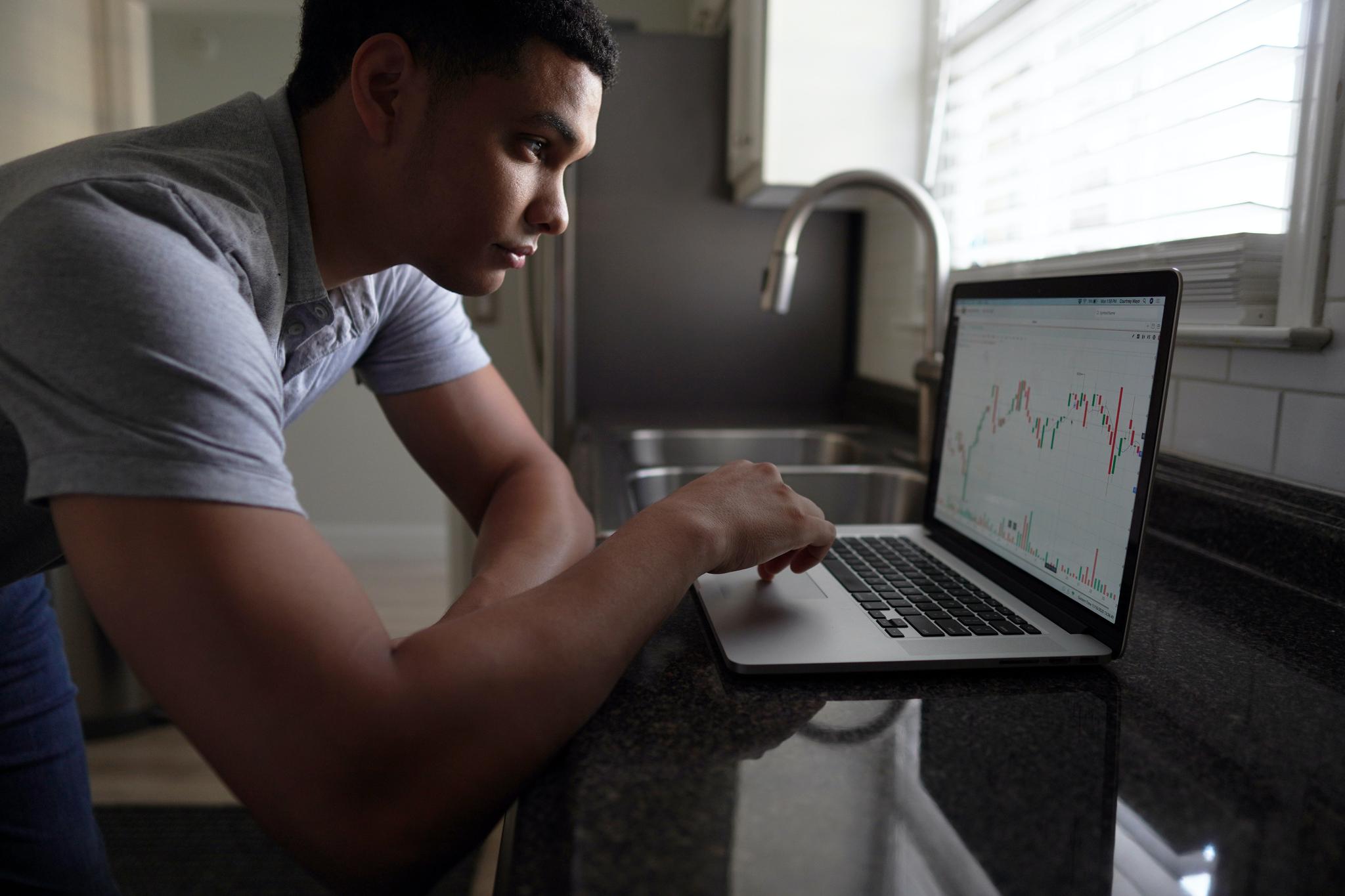 man looking at laptop