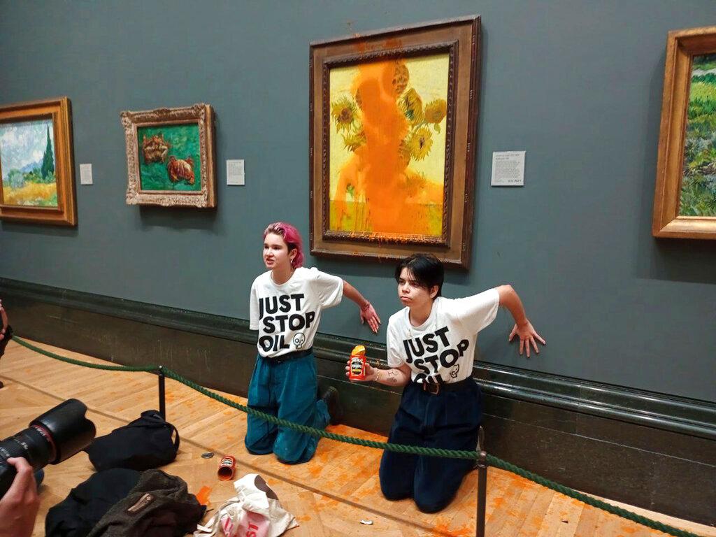 2 protesters who threw soup at Vincent Van Gogh's famous 1888 work Sunflowers at the National Gallery in London