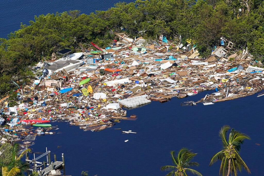 Debris is piled up at the end of a cove following heavy winds and storm surge caused by Hurricane Ian